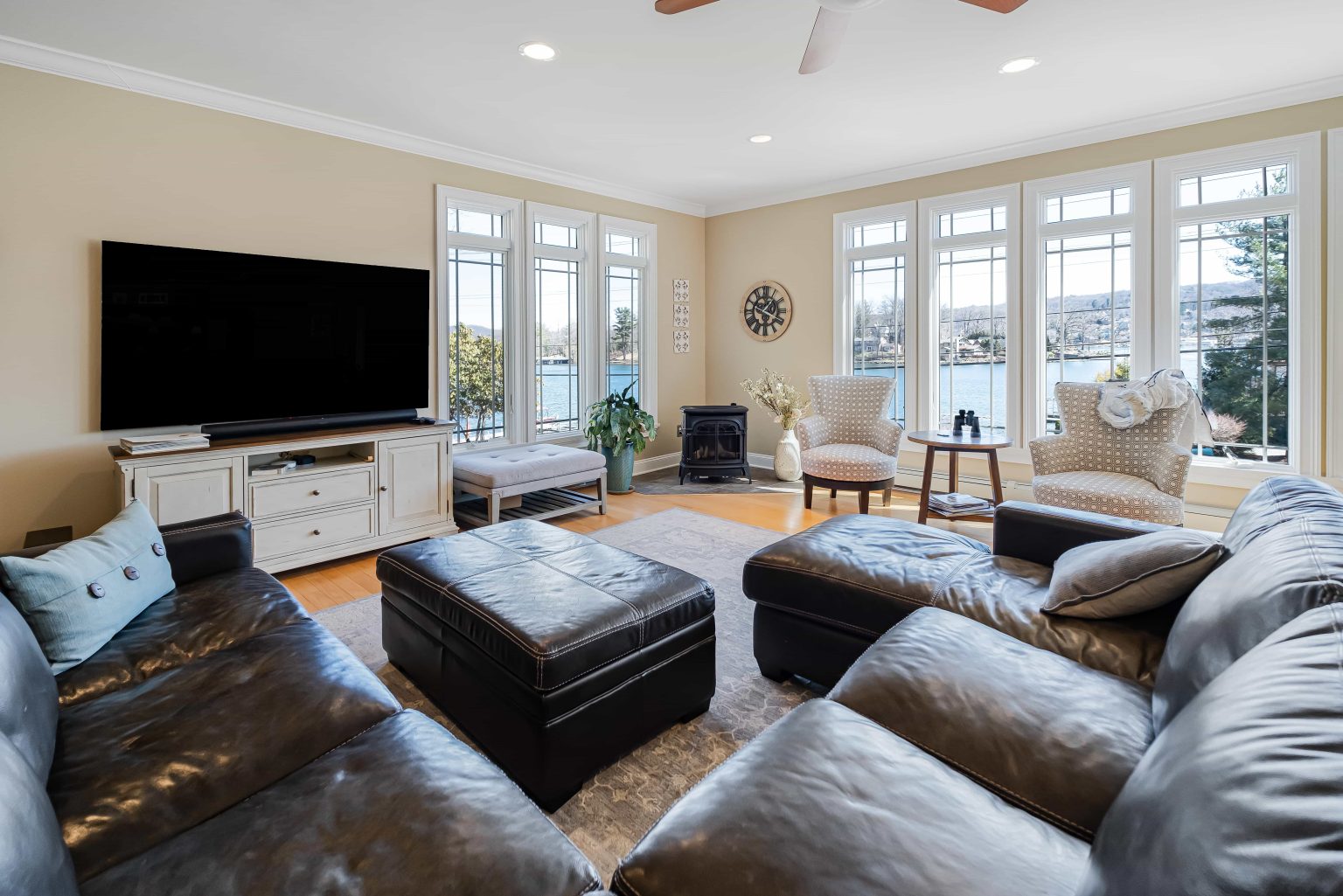 Lakefront living room with large windows overlooking the water