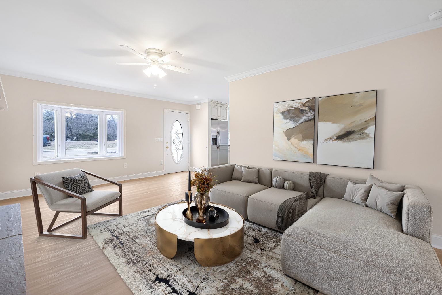 Virtually staged living room with a sectional sofa, armchair and coffee table